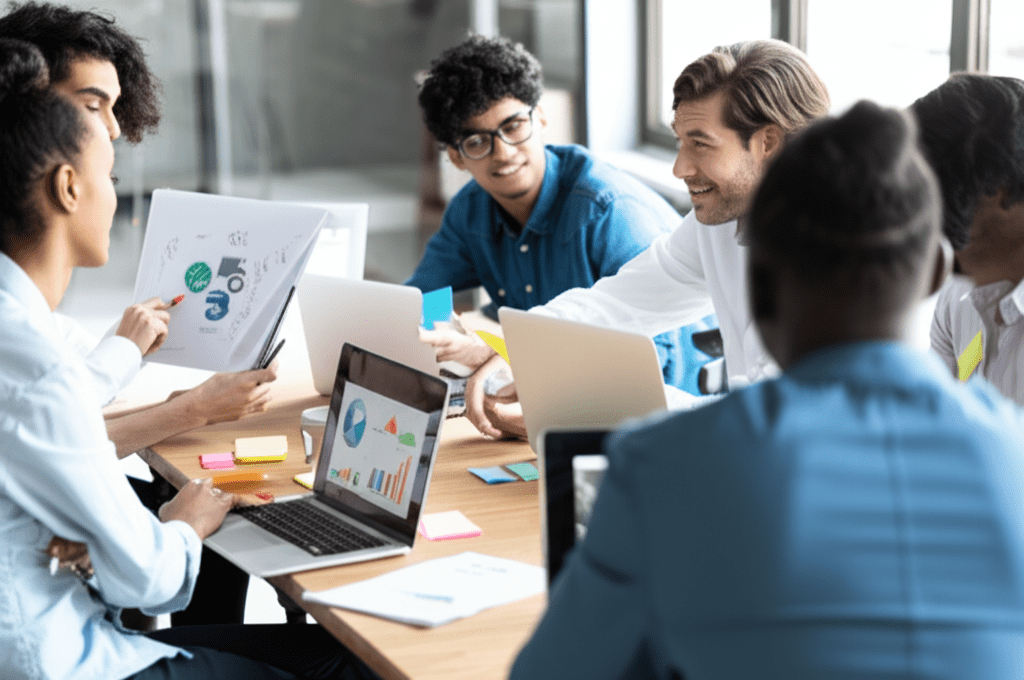 A diverse group of tech professionals collaborating in a modern office environment, symbolizing fractional CTO leadership, team building, and innovation in startups and SMEs.