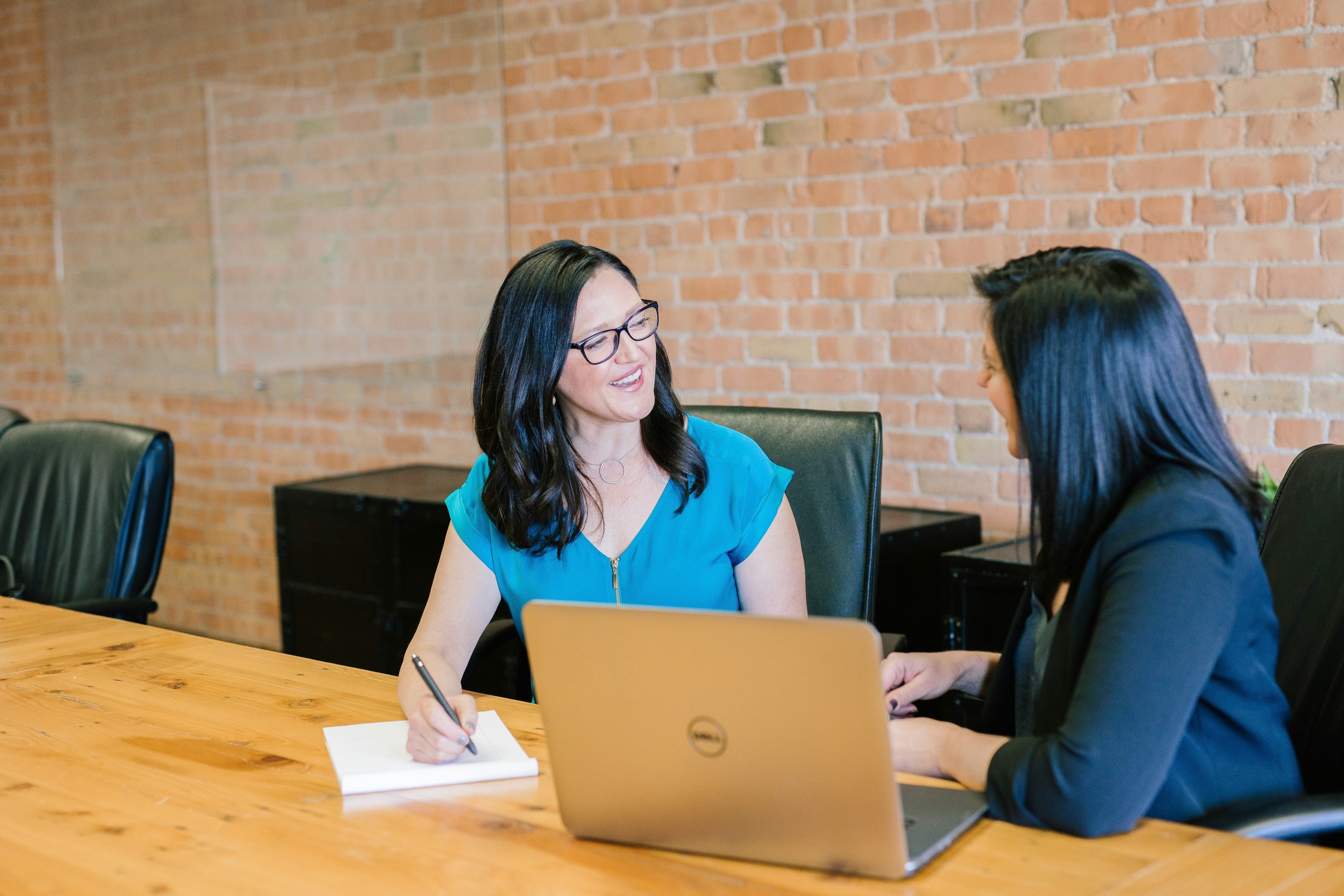 Diverse professionals collaborating in a modern startup office, symbolizing fractional CTO leadership and equity compensation in a bright, innovative environment