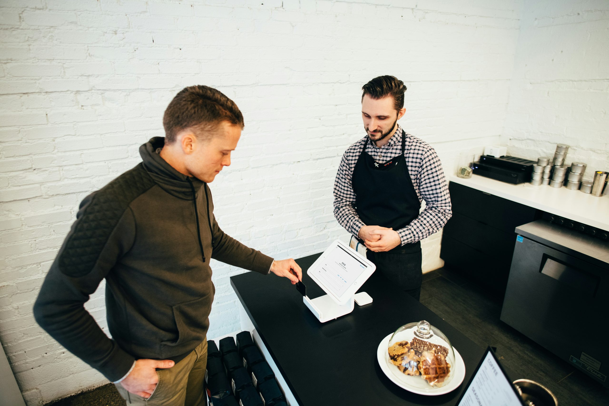 Diverse professionals collaborating in a modern office setting with technology elements, symbolizing fractional CTO leadership in digital transformation within regulated industries